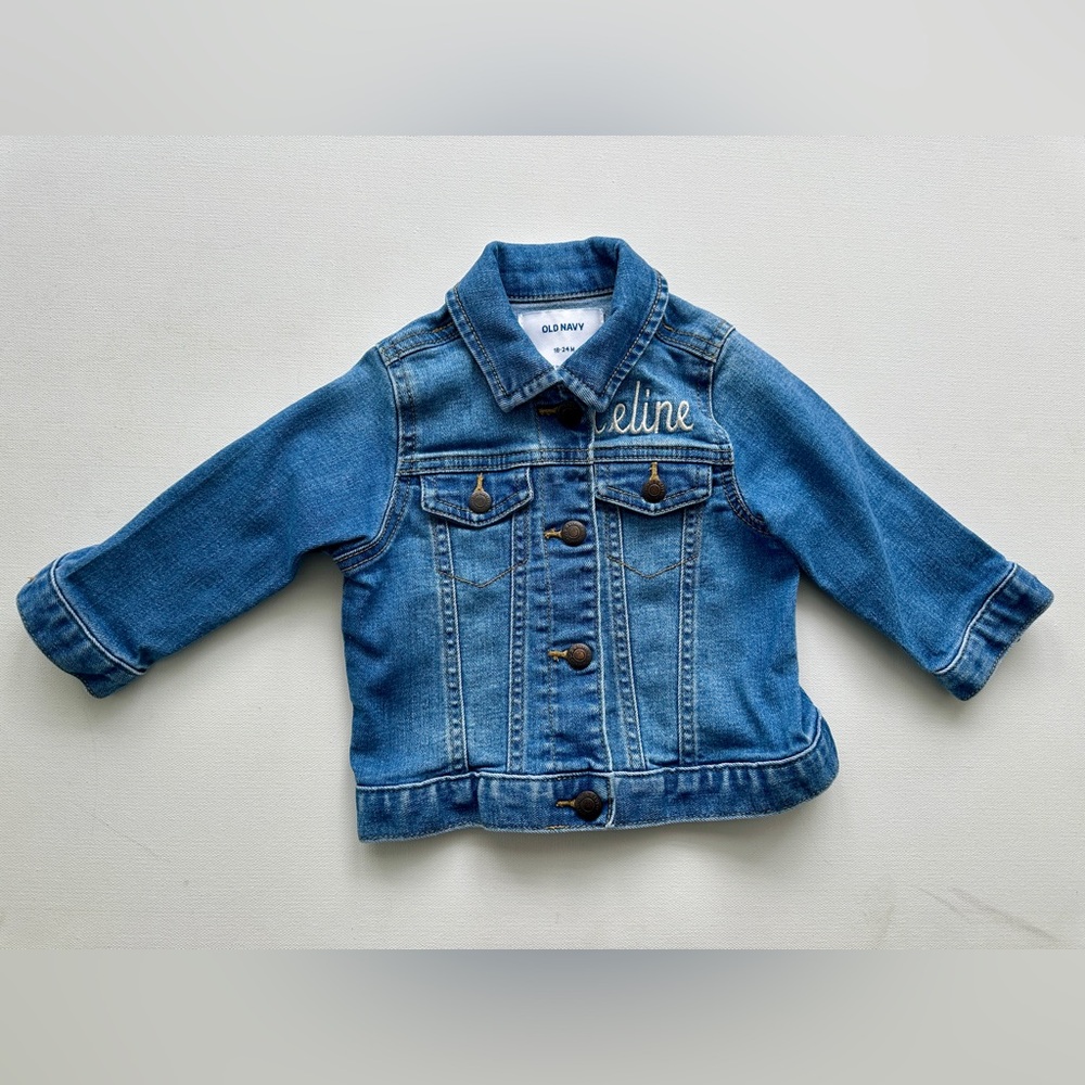 Old navy girl’s navy jean jacket with print name “Celine”.  Size 18-24M.